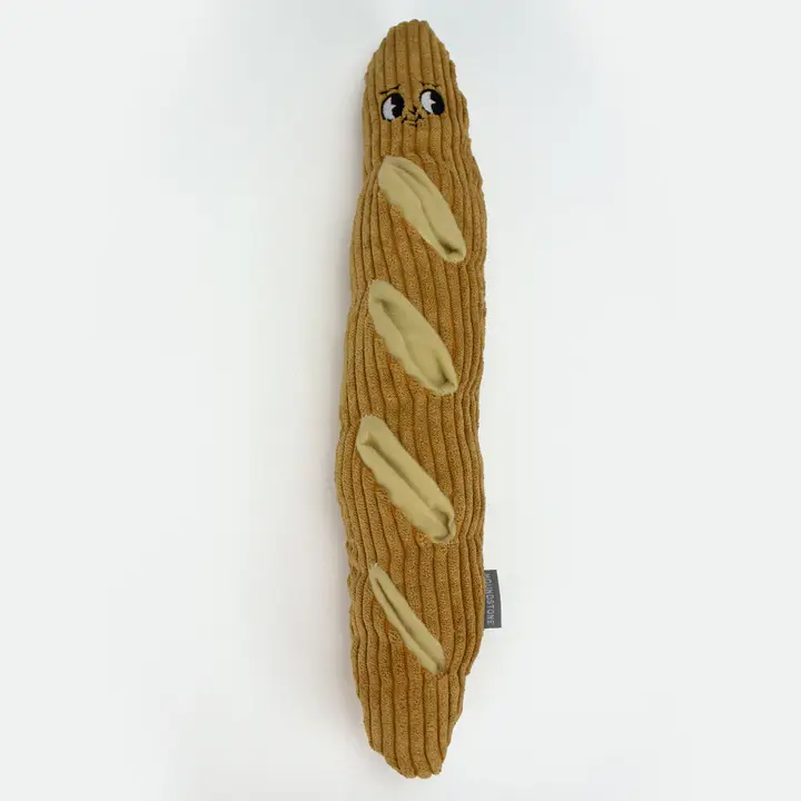 Baguette-shaped interactive plush dog toy